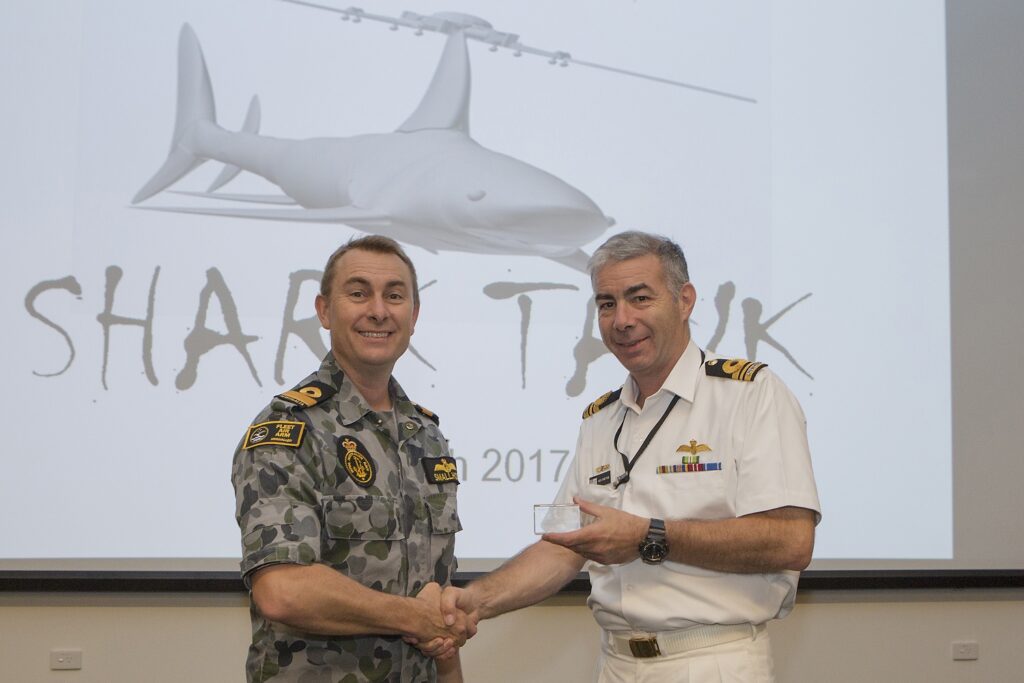 COMFAA congratulating LCDR Peter Stretton on the development of his concept and presenting him with a FAAST 'Presenters' Award.