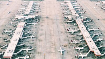 Aerial photo of an airport with planes lined up at terminals